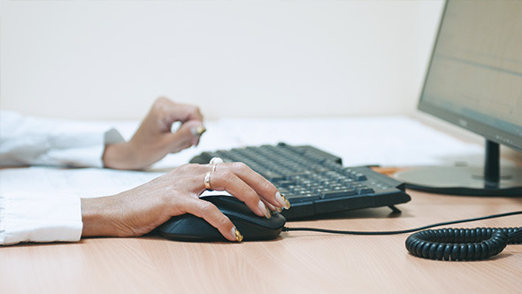 Woman in Office Use Computer Mouse