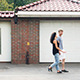 Neighbors Couple Walking Along the House - VideoHive Item for Sale