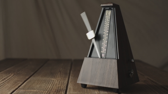 Vintage Metronome, On a Dark Background.