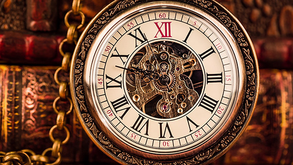 Pocket Watch Against Old Books