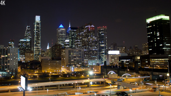 Philadelphia Night Skyline Against Highway Traffic