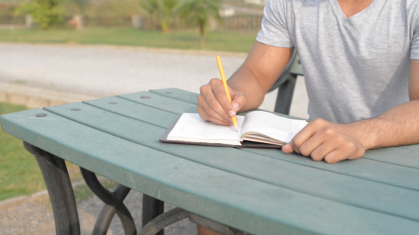 Writing Idea on Diary, While Relaxing in Park