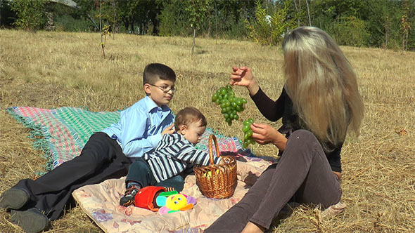 Mother With Kids on a Picnic