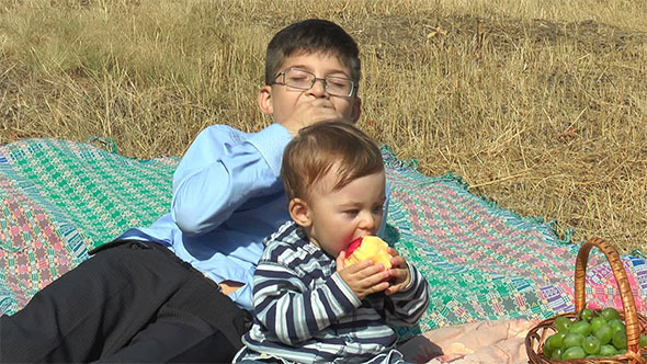 Two Boys Eating Apples