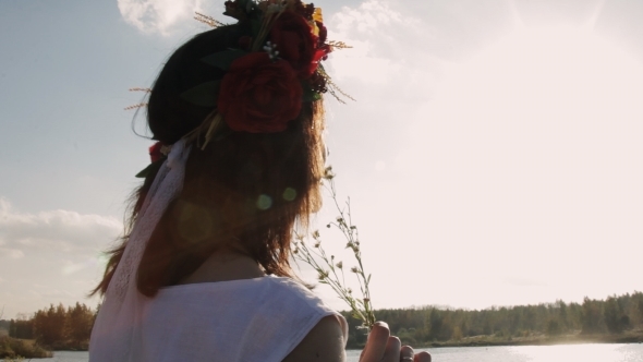 Beautiful Brunette With a Wreath On Her Head Looks