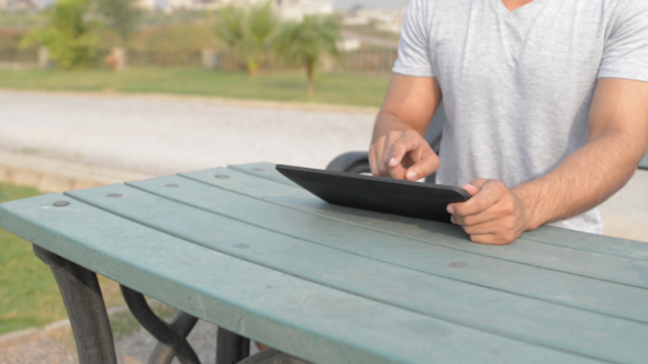 Relax Young  Man Using Tablet alt