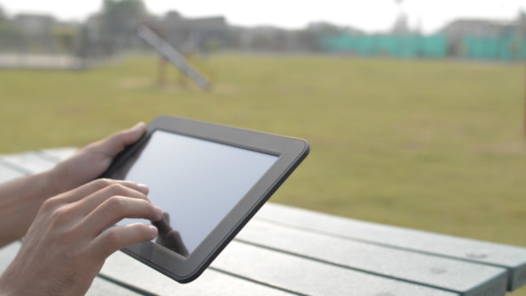 Man Hands Typing Message on Digital Tablet