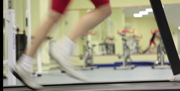 Woman Exercising Against Mirror