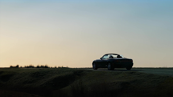 Cars Pass In Dramatic Morning Light