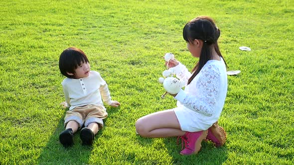 Cute Asian Children Holding Mushroom In The Park