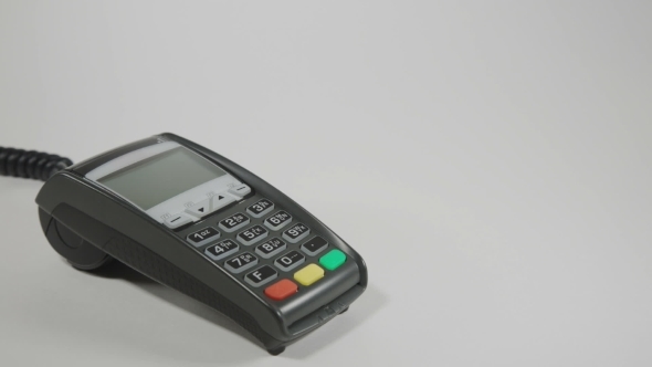 Hand Swiping Credit Card On POS Terminal