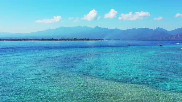 Beautiful sea texture with crystal emerald water of turquoise lagoon around seashore of tropical isl