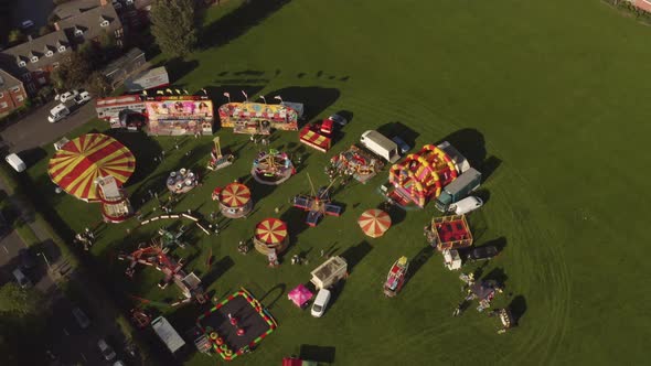 An aerial view of a fairground and circus in a field in Northern England