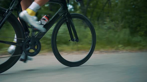 Cyclist Training Leisure Twists Pedals On Triathlon Bicycle. Gear System  And Bike Wheel. Fitness.