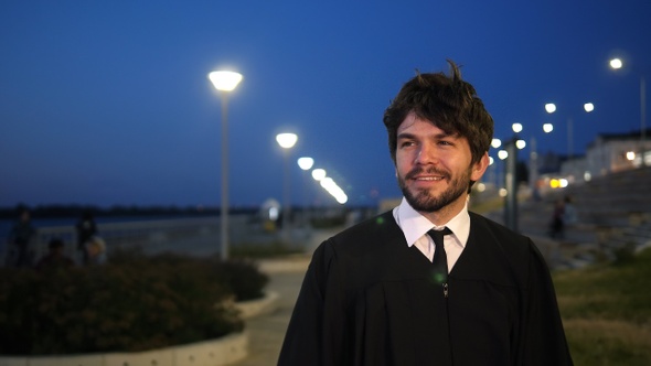 Man Walking After the Graduation Ceremony