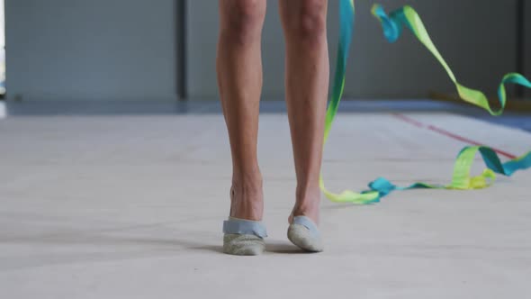 Female gymnast performing at sports hall