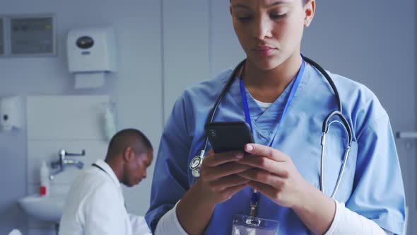 Close-up of African American female doctor using mobile phone in hospital 4k