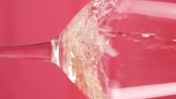 Vertical video, Close-up: red wine is poured into a glass