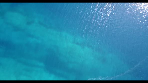 Aerial drone shot nature of tranquil shore beach holiday by transparent lagoon and clean sandy backg