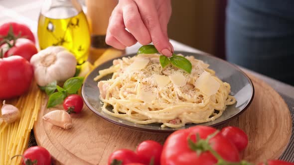 Making Pasta Carbonara  Pouring Fresh Basil to Parmesan Cheese Spaghetti Ceramic Dish