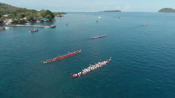 Aerial: kora-kora traditional canoe annual race in Banda Neira in Indonesia