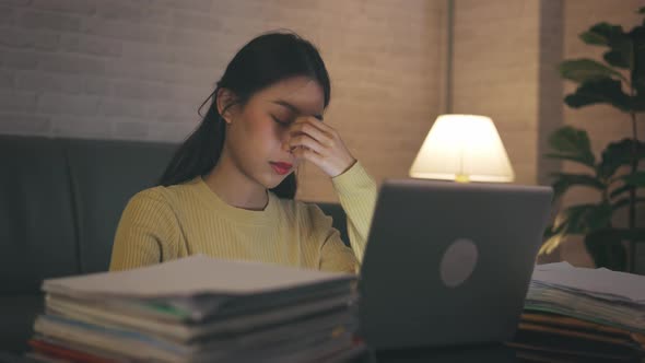 Stressed Woman Working on Laptop