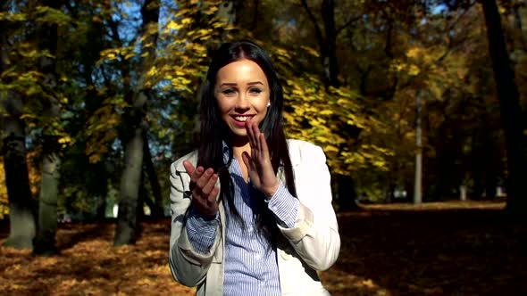 Slowmotion Young Beautiful Happy Woman Stands in Woods and Applauds