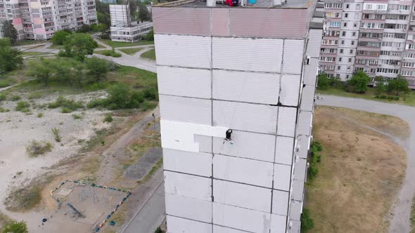 Industrial Alpinism. Aerial View. Work on Outer Insulate Building with Styrofoam