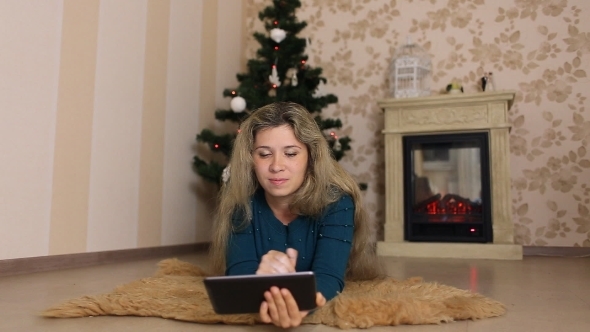 Young Woman Sitting Alone, In Front Of Christmas