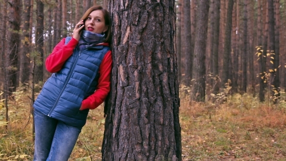 Phone Conversation In The Autumn Forest