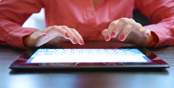 Woman's Hands Using Tablet