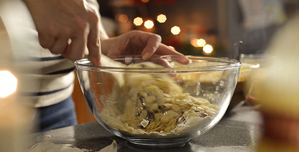 Woman Mixes Cherries and Almonds with Flour