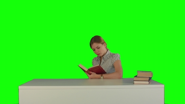 Female Student Reading a Book For Finding
