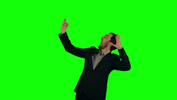 Businessman Taking a Selfie On a Green Screen