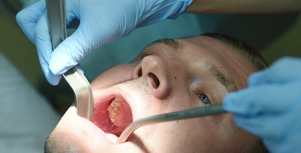 Dentist Drills Tooth