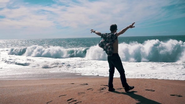 Man Have Fun On Beach With Big Waves