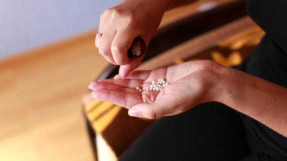 Woman Taking Tablets