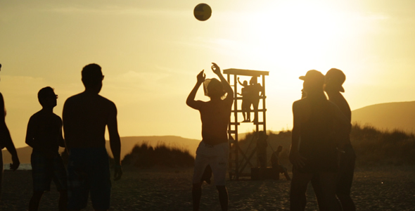 Young People Playing Beach Ball at Sunset 2
