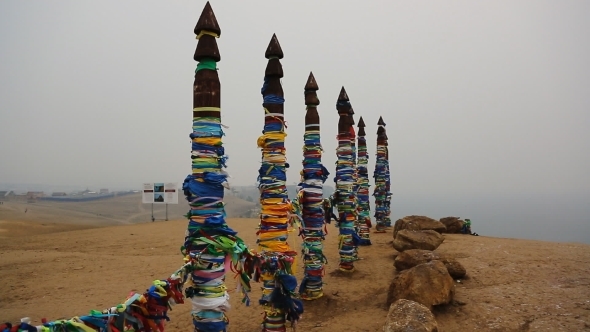 Wooden Shaman Totems With Ribbons Near Holy Cape