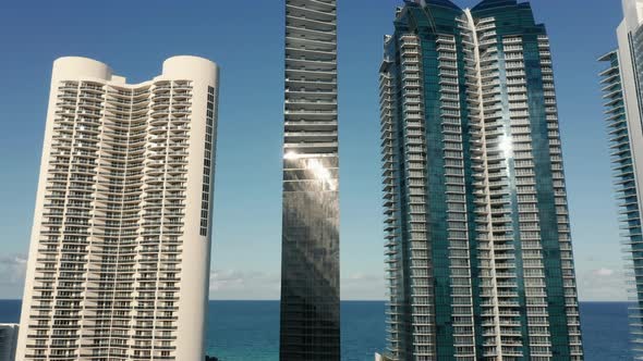 Sun Light Reflects in Windows of Seafront Glass Apartment Towers,  Miami, USA alt