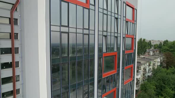 Aerial View of the Exterior of a Modern Hotel Building with Large Windows