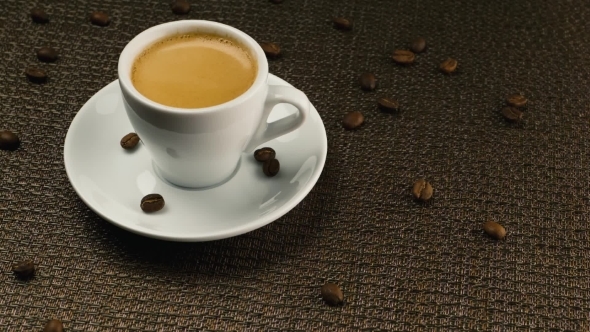 A Cup Of Espresso On a Dark Napkin