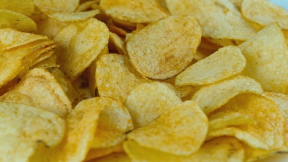Potato Chips Are Rotated In Front Of Camera