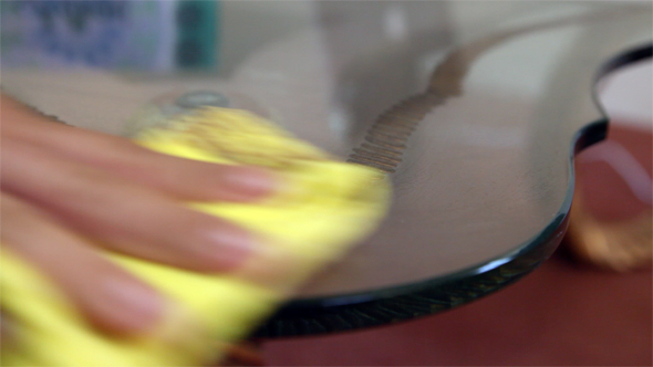 Cleaning - Dusting a Glass Table