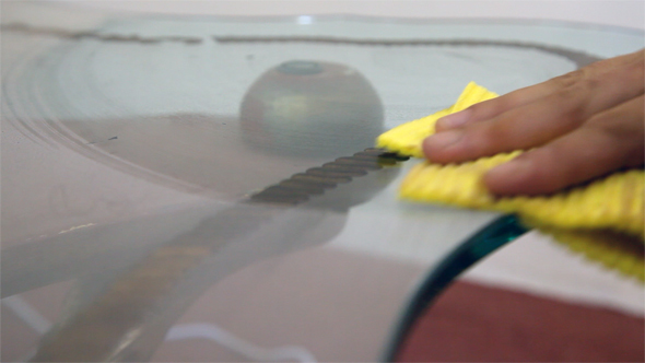 Cleaning - Removing Dust from a table with a Rag