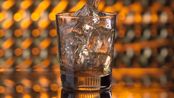 Pouring Whiskey into Glass 
