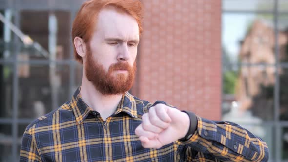 Outdoor Waiting Redhead Beard Young Man Watching Time on Watch