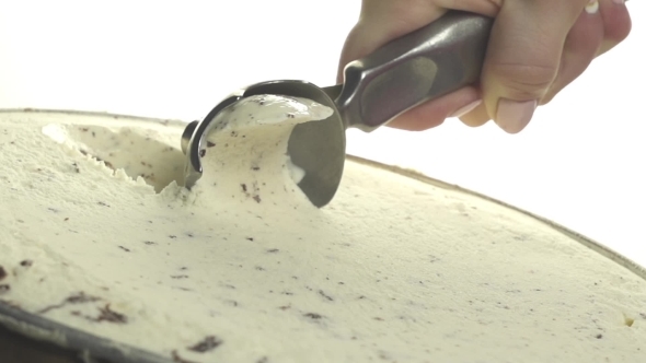 Vanilla Ice Cream Scooped Out Of Container