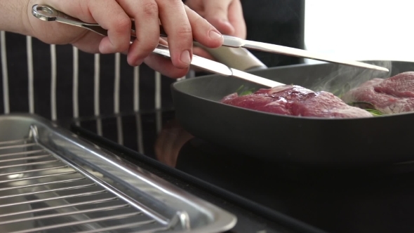 Chef Is Grilling Steaks