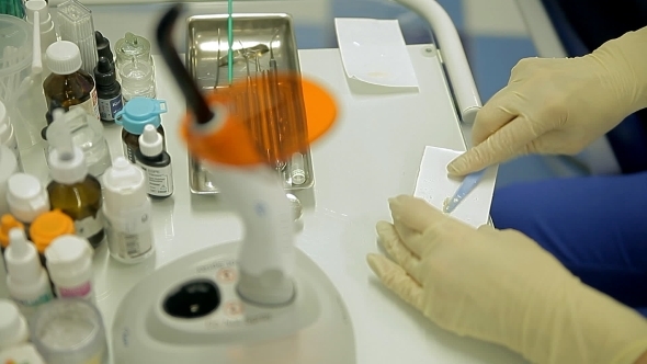 Doctor Uses The Dental Tools